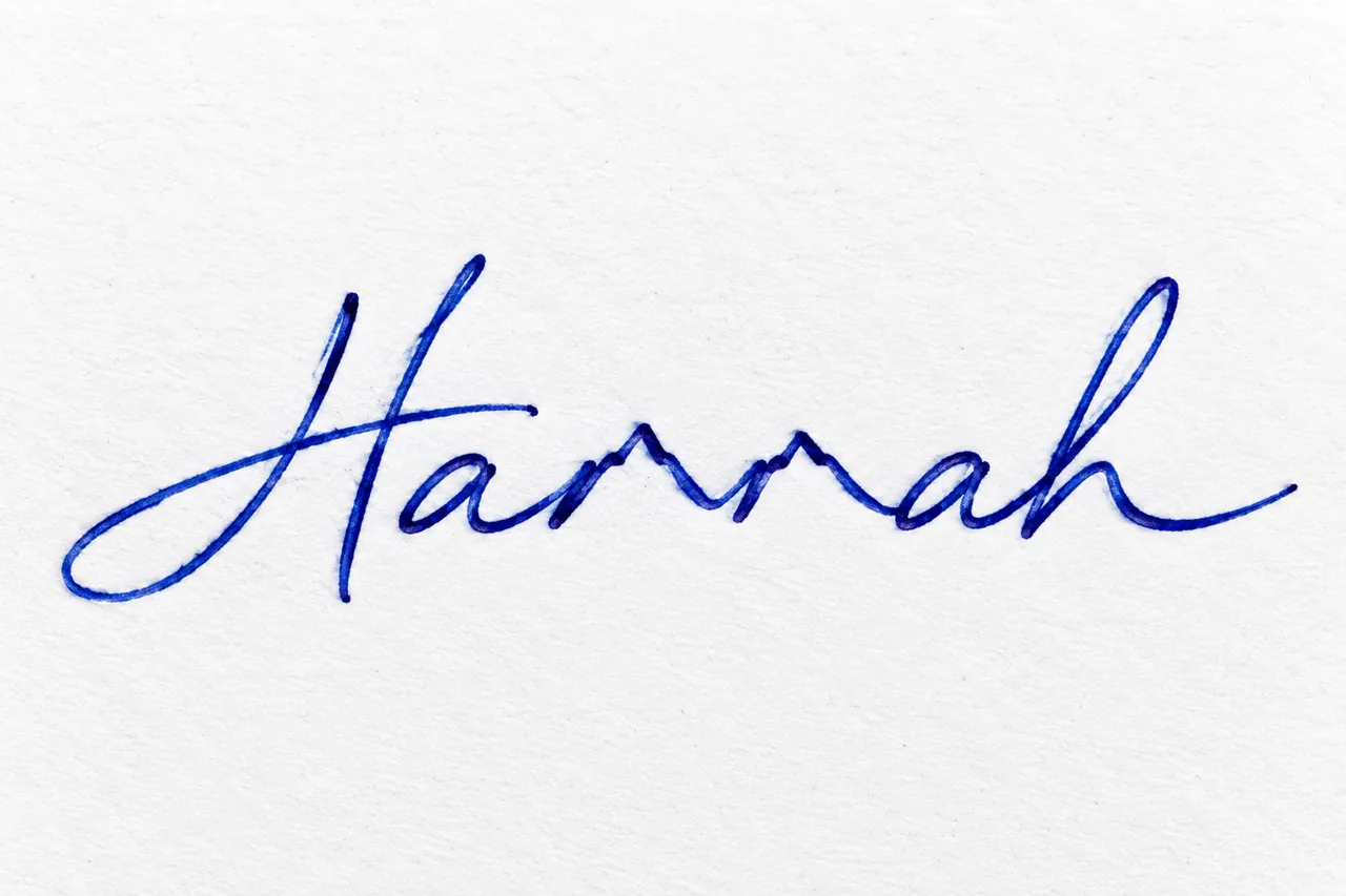 Hannah in blue fountain pen ink with the two middle n letters rising into a connected mountain range